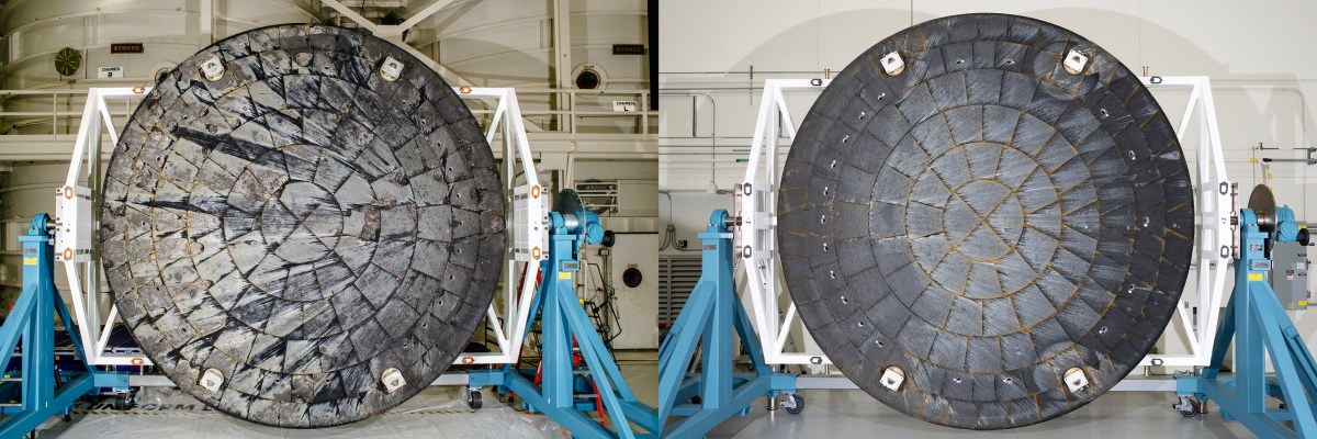 Two circular Orion heat shields side by side in a workshop, with more visible cracks and pale areas on the left shield.